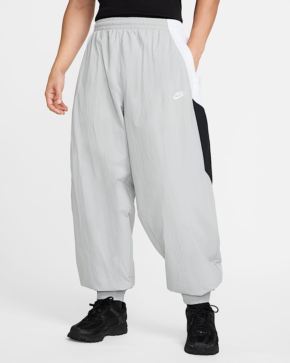 Nike swoosh woven track pants on sale